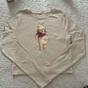 long sleeve creme colored crop top w/ winnie the pooh